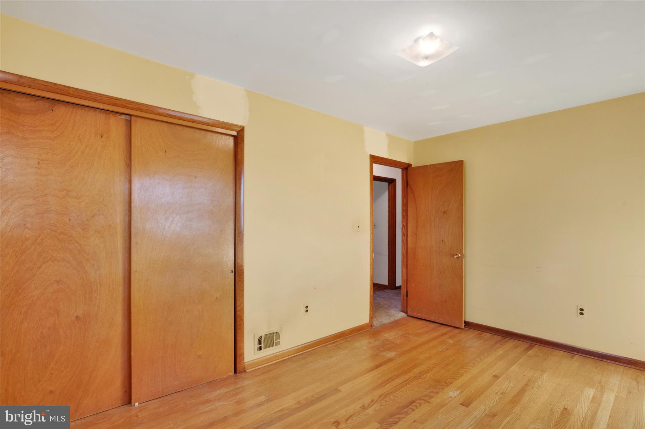 1505 Southview Road Bel Air, MD 21015 - Photo 15 of 25 a view of an empty room with wooden floor and closet