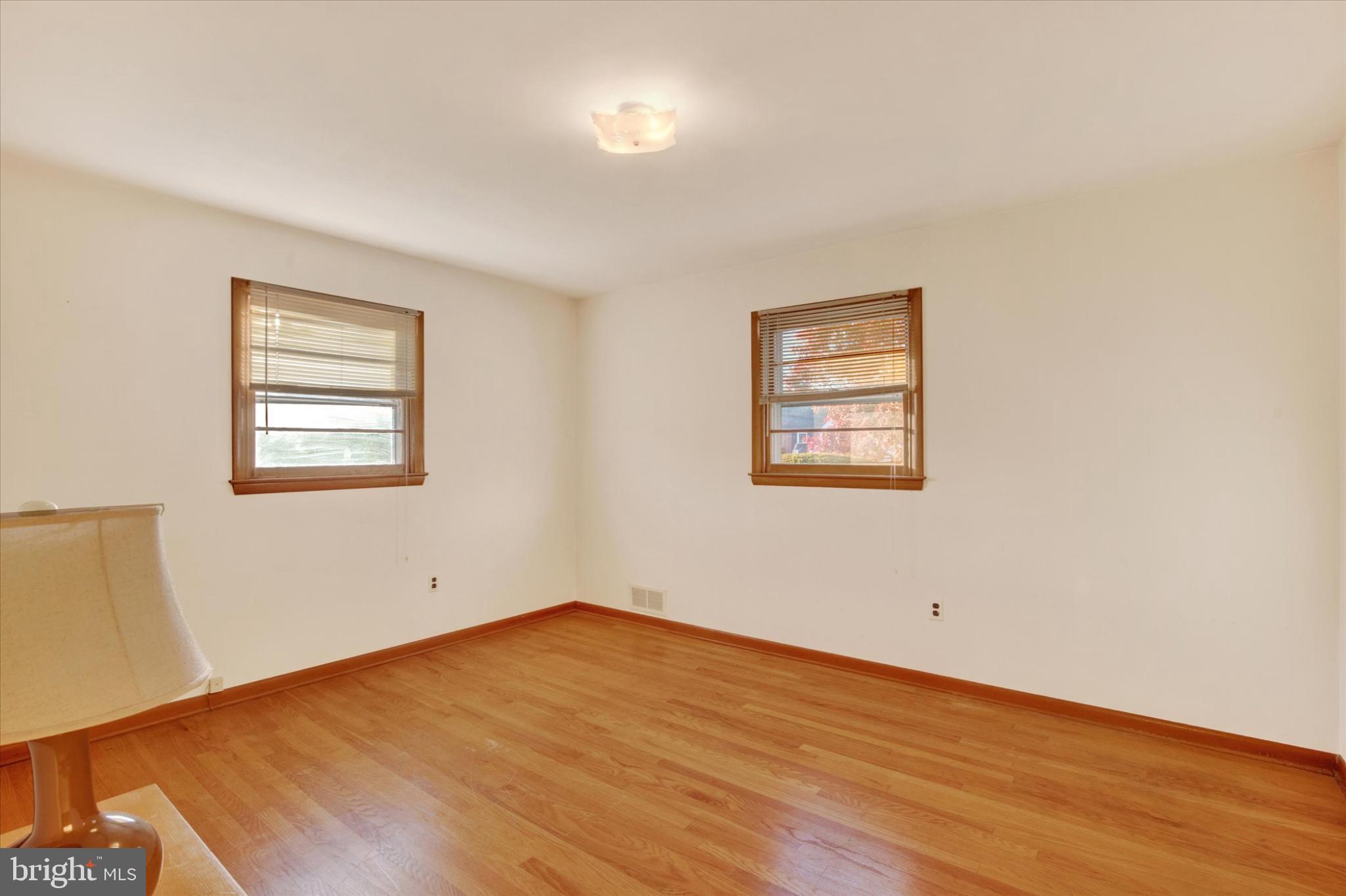 1505 Southview Road Bel Air, MD 21015 - Photo 16 of 25 a view of an empty room with wooden floor and a window