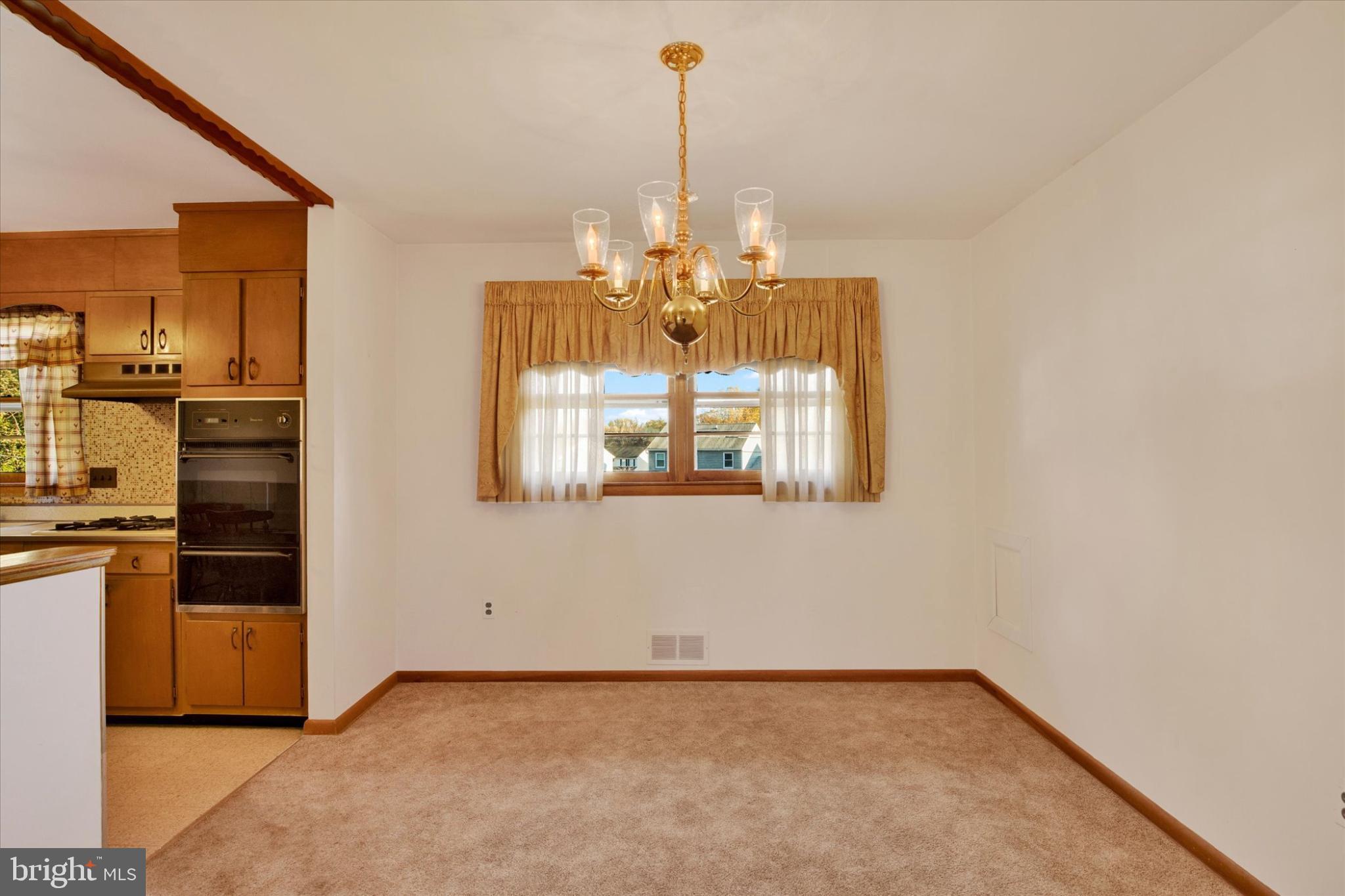 1505 Southview Road Bel Air, MD 21015 - Photo 8 of 25 a view of a kitchen with a stove cabinets and a floor to ceiling window