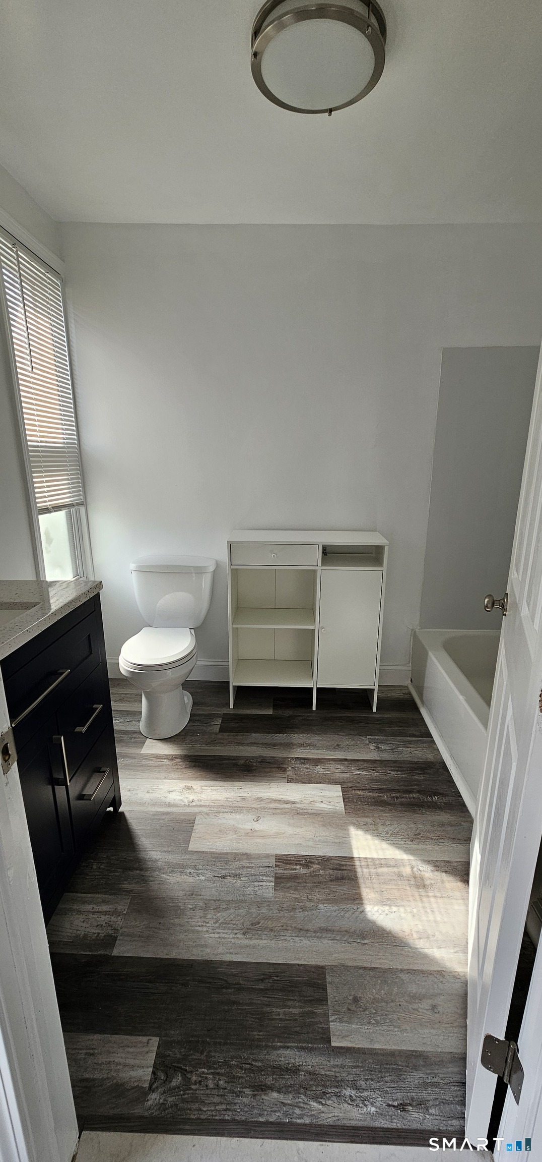 315 Grove Street Meriden, CT 06451 - Photo 8 of 11 a bathroom with a sink and a toilet