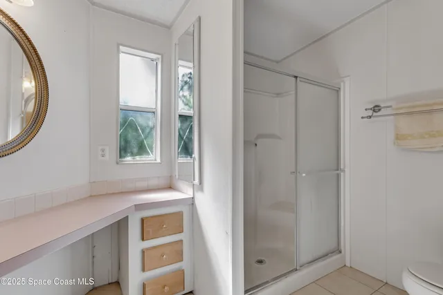a view of walk in closet with window