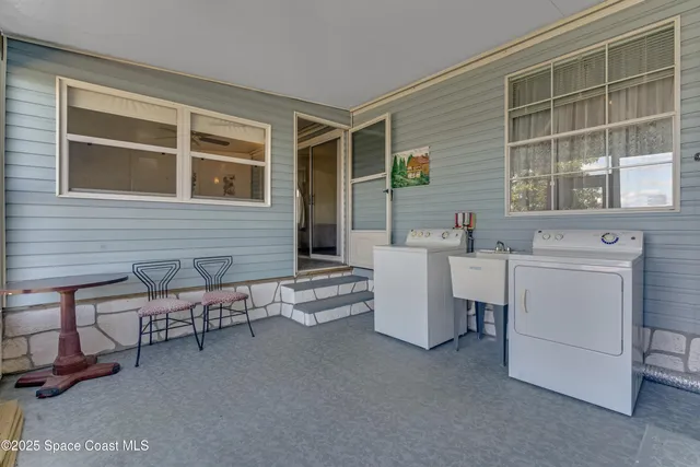 a dining room with furniture and windows