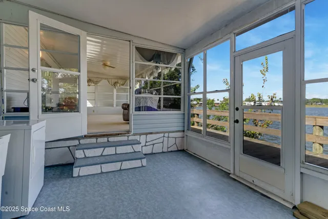a kitchen with stainless steel appliances kitchen island granite countertop a refrigerator and a stove