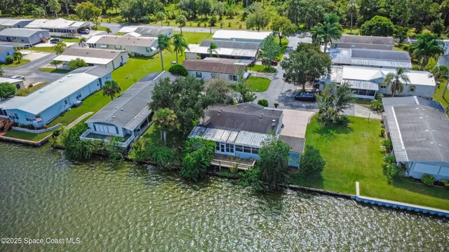 an aerial view of a house with a garden
