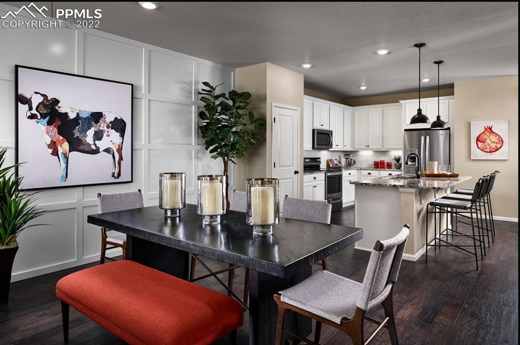 4365 Hidden Gulch Road Castle Rock, CO 80104 - Photo 3 of 5 a dining room with furniture and window