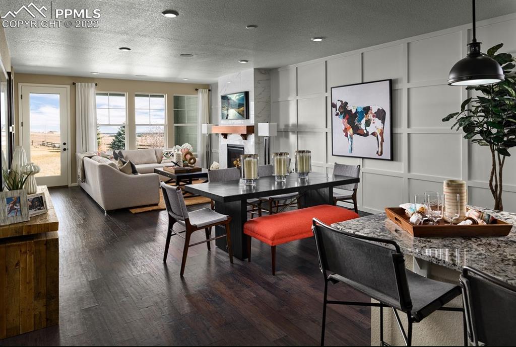 4365 Hidden Gulch Road Castle Rock, CO 80104 - Photo 4 of 5 a dining room with furniture and window