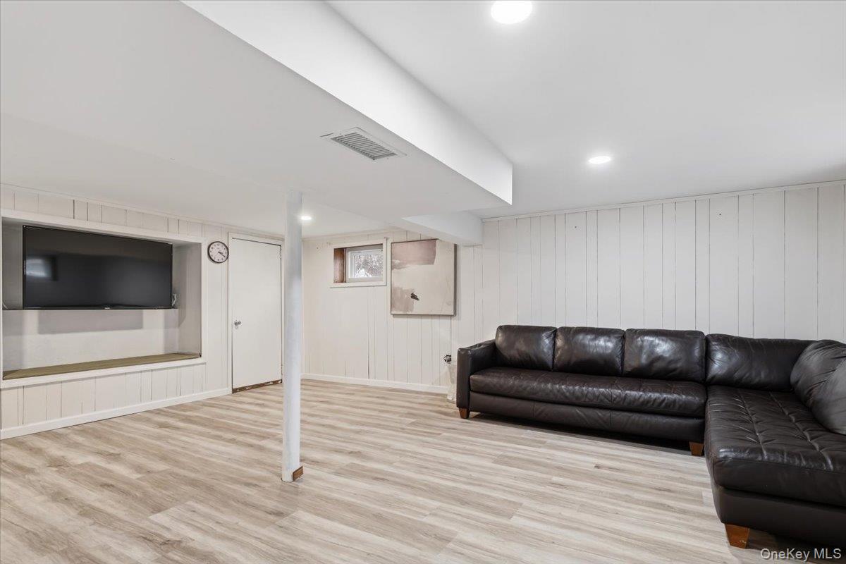 39 Darling Avenue New Rochelle, NY 10804 - Photo 14 of 19 a living room with a couch and a flat screen tv