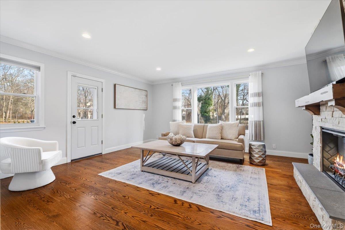 39 Darling Avenue New Rochelle, NY 10804 - Photo 6 of 19 a living room with fireplace furniture and a wooden floor