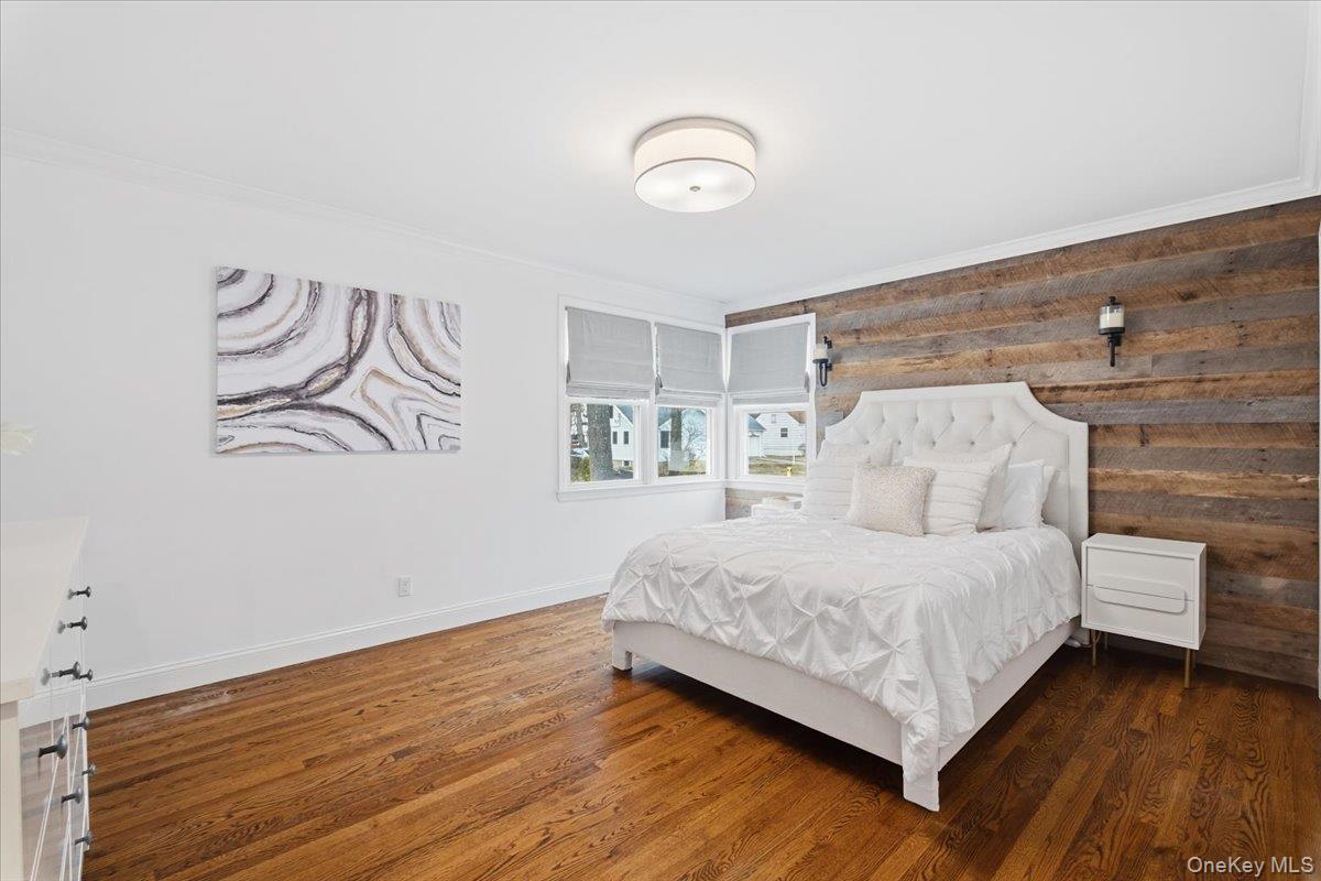 39 Darling Avenue New Rochelle, NY 10804 - Photo 9 of 19 a bedroom with a bed and painting on the wall