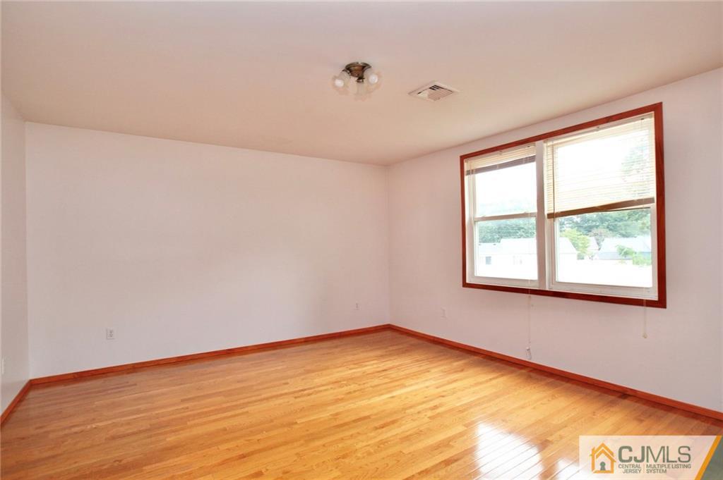 16 Ashley Road Edison, NJ 08817 - Photo 22 of 25 a view of an empty room with a window