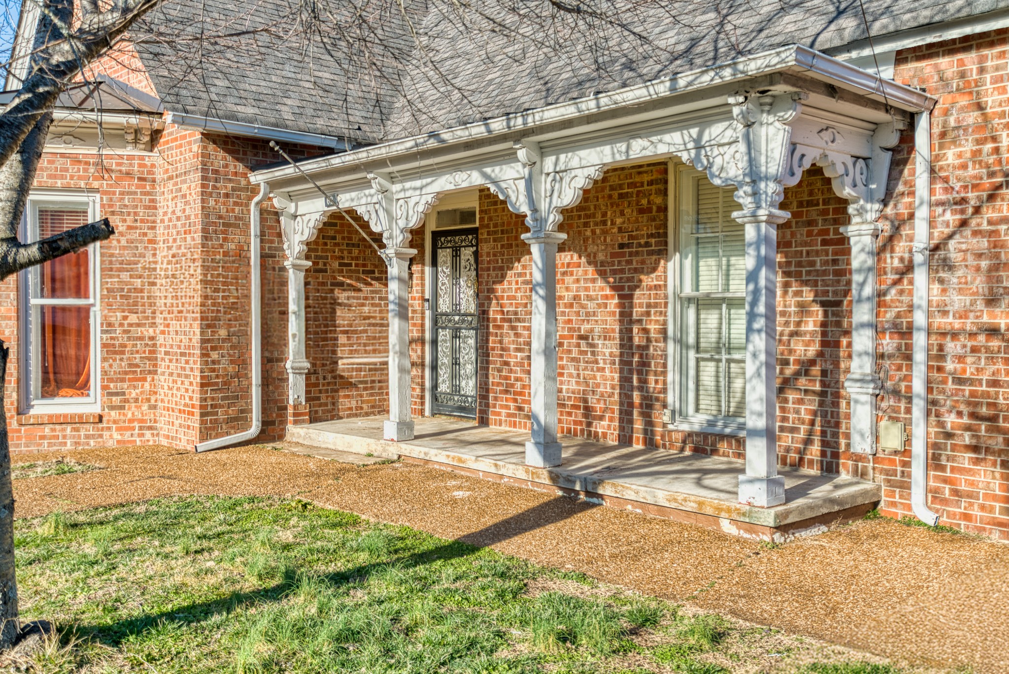 62 North Main Street Springfield, TN 37172 - Photo 4 of 40 a view of a brick house with a large windows