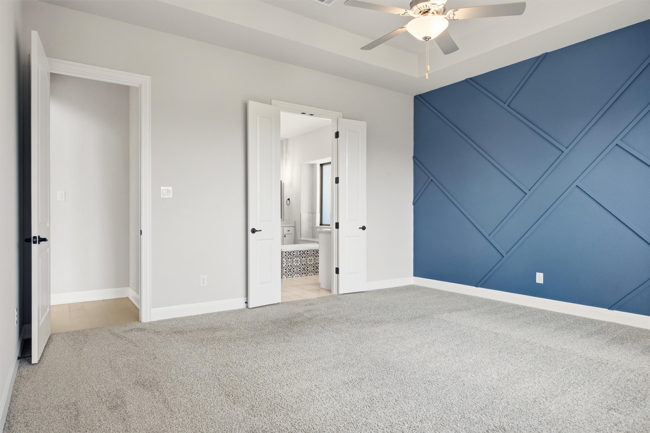 208 Tovas Secret Cove Georgetown, TX 78628 - Photo 15 of 40 a view of an empty room with a ceiling fan