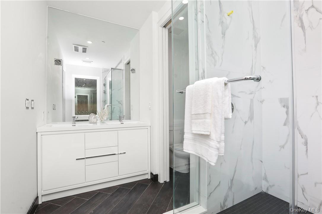 145 Library Lane, Unit 4A Mamaroneck, NY 10543 - Photo 14 of 27 Master Bath has double vanity and private water closet.