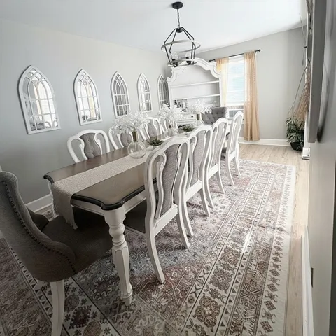 a view of a dining room with furniture