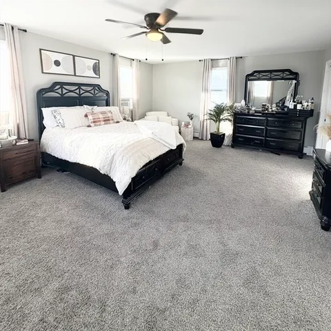 a bedroom with a bed and window