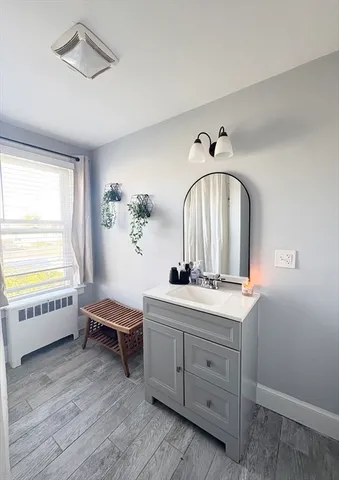 a spacious bedroom with a large bed and a window