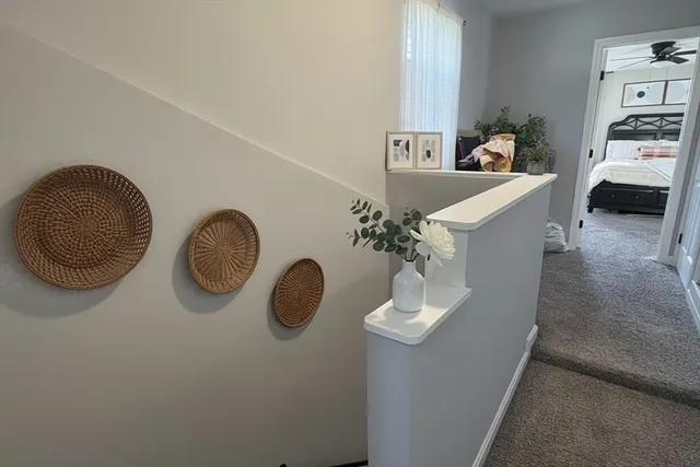 a living room with furniture and a mirror