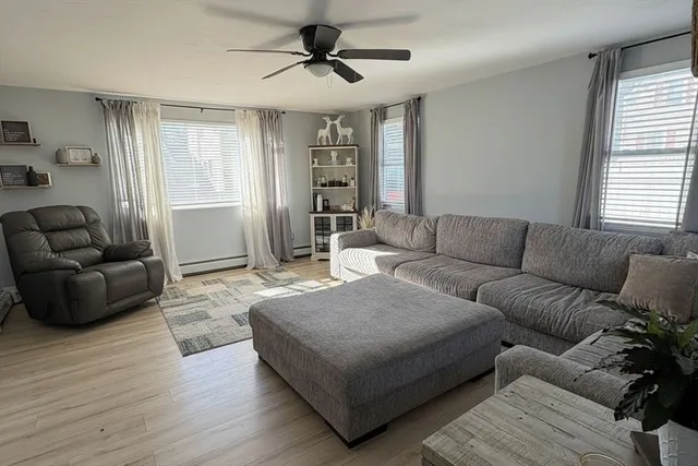 a living room with furniture and a window