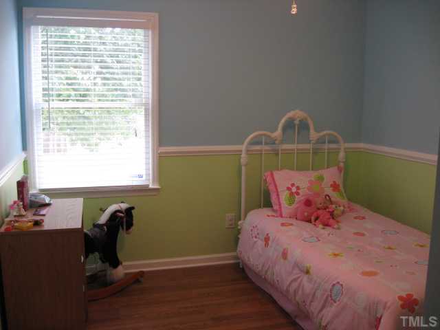 4000 Old Coach Road Raleigh, NC 27616 - Photo 12 of 12 a bedroom with a bed and a window