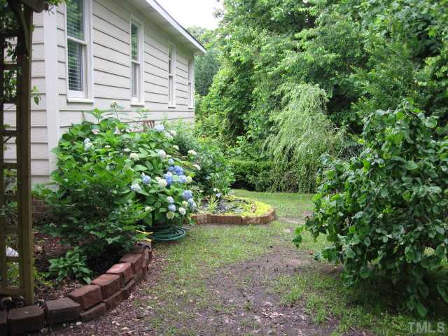 4000 Old Coach Road Raleigh, NC 27616 - Photo 3 of 12 a view of a backyard with plants