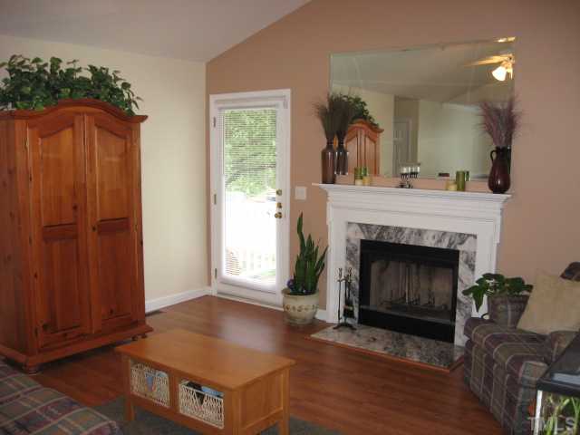 4000 Old Coach Road Raleigh, NC 27616 - Photo 4 of 12 a living room with furniture and a fireplace