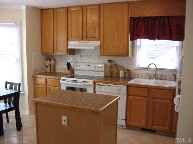 4000 Old Coach Road Raleigh, NC 27616 - Photo 6 of 12 a kitchen with a sink cabinets and a window