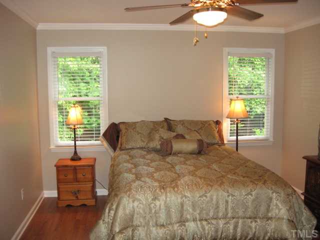 4000 Old Coach Road Raleigh, NC 27616 - Photo 9 of 12 a bed sitting in a bedroom next to a window