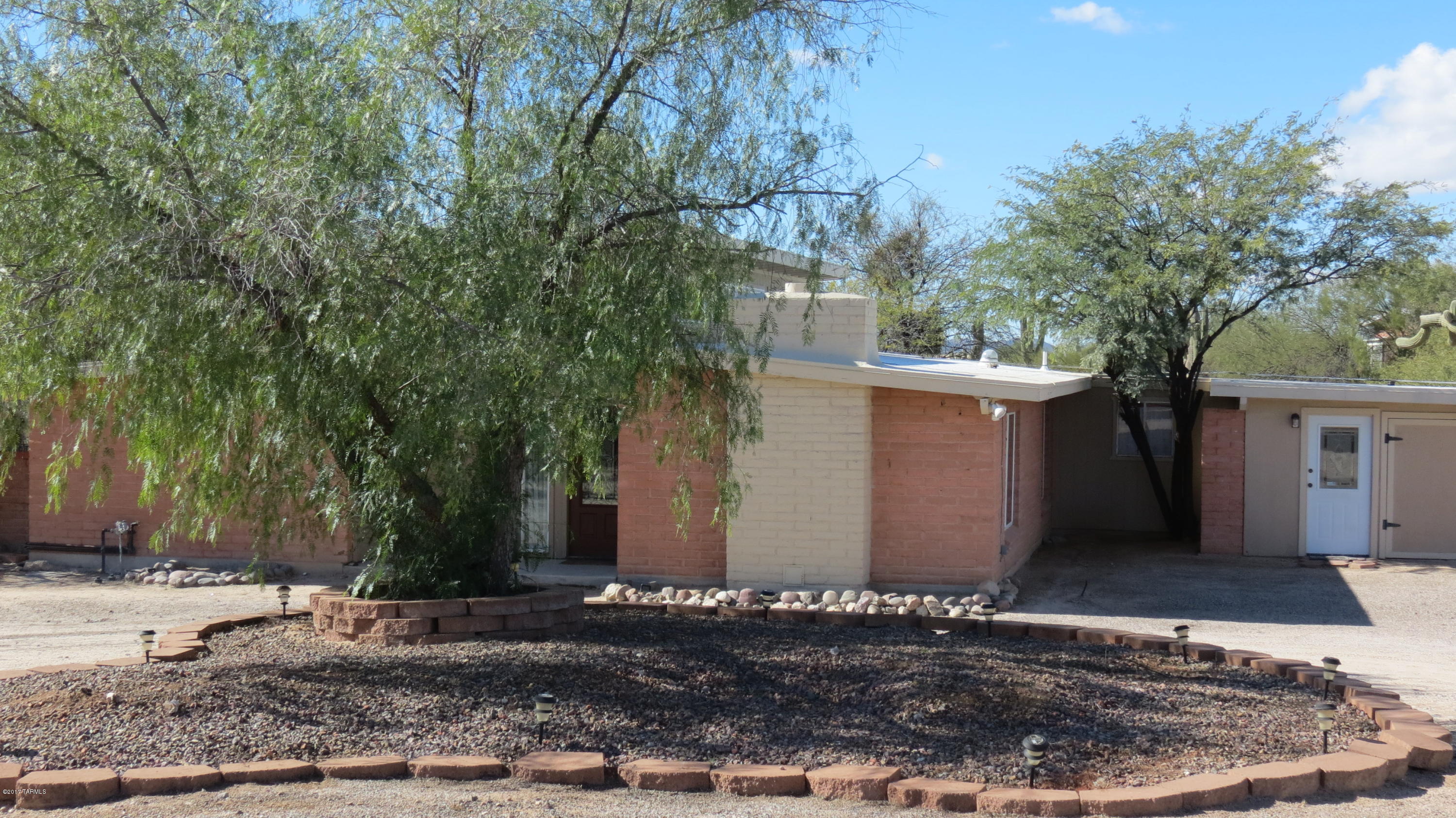 6601 North Mona Lisa Road Tucson, AZ 85741 - Photo 1 of 23 a view of a house with a yard