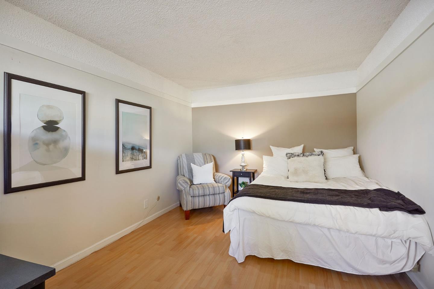 500 West Middlefield Road, Unit 93 Mountain View, CA 94043 - Photo 12 of 29 a bedroom with a bed and a painting on the wall