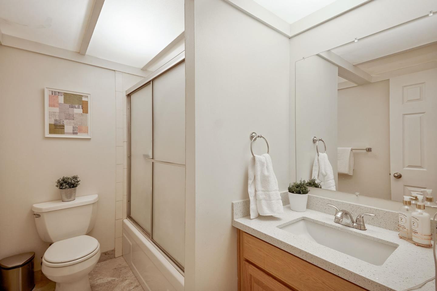 500 West Middlefield Road, Unit 93 Mountain View, CA 94043 - Photo 14 of 29 a bathroom with a sink mirror vanity and toilet