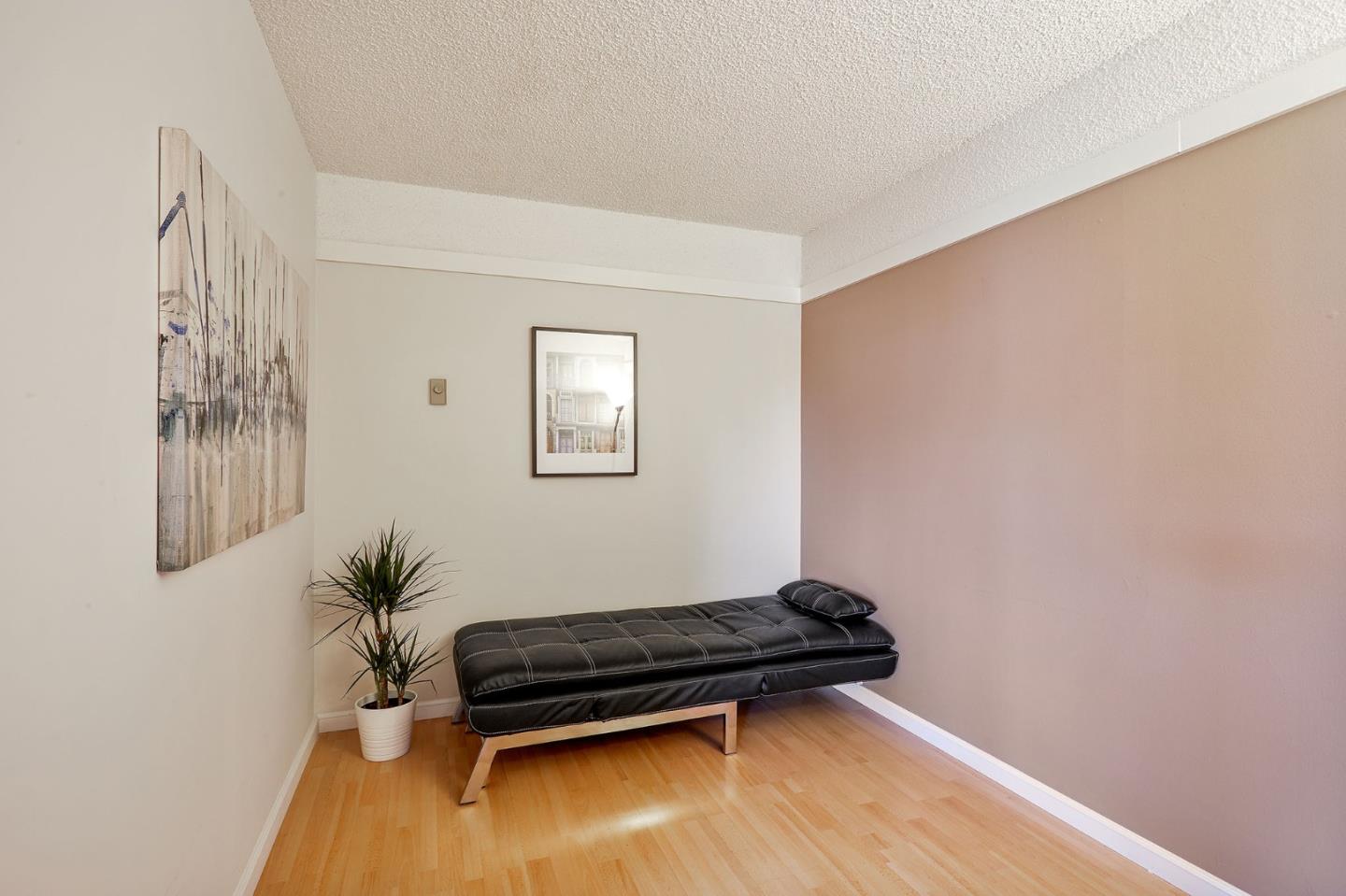 500 West Middlefield Road, Unit 93 Mountain View, CA 94043 - Photo 16 of 29 a room with furniture and a potted plant
