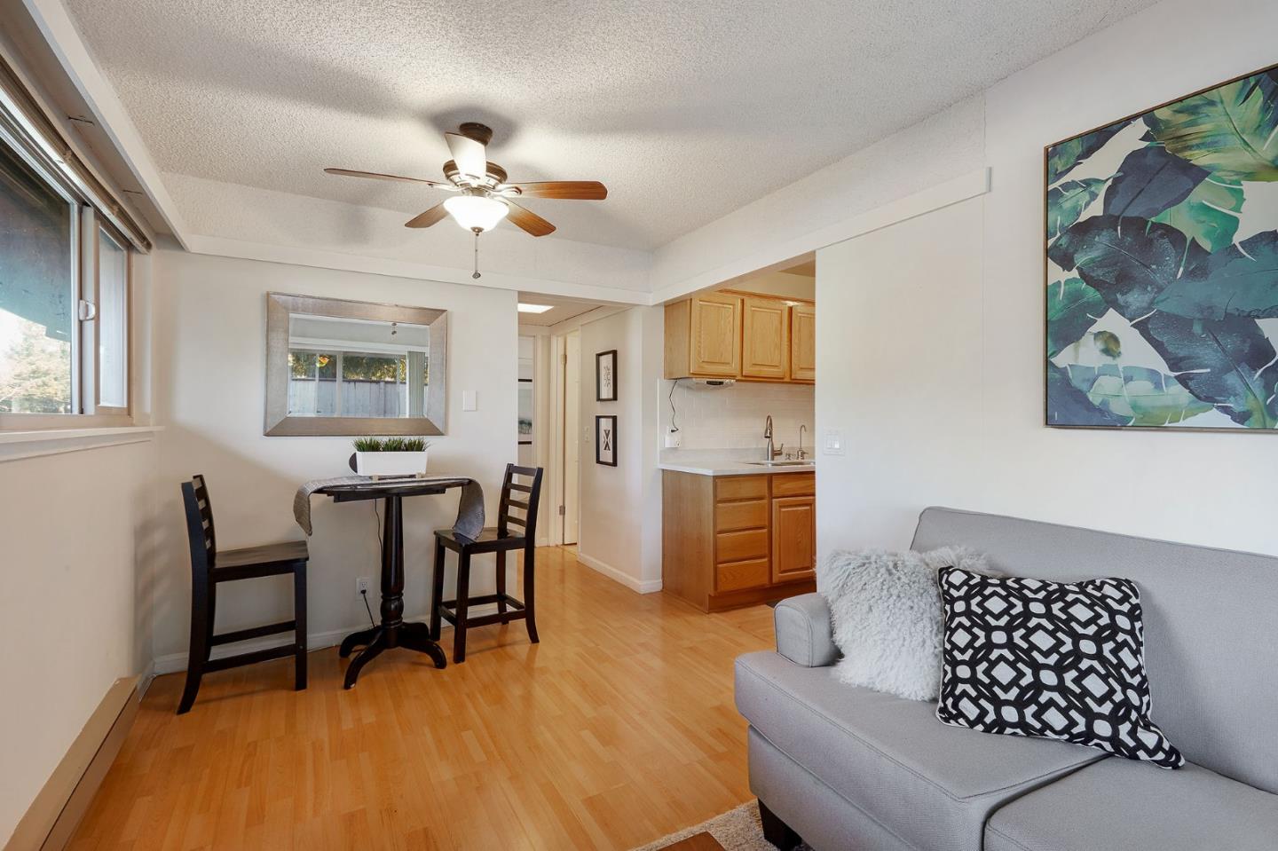 500 West Middlefield Road, Unit 93 Mountain View, CA 94043 - Photo 5 of 29 a living room with furniture and a chandelier