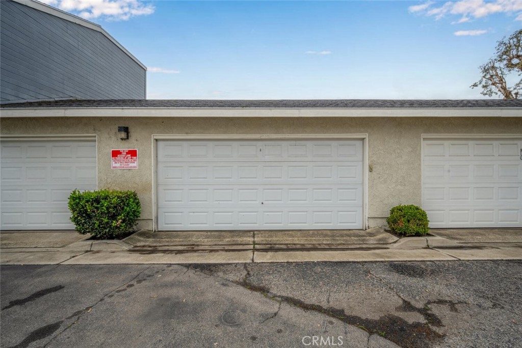 701 South Hayward Street, Unit B Anaheim, CA 92804 - Photo 29 of 31 Two car garage conveniently located just steps away from the unit. There are cabinets inside for additional storage.