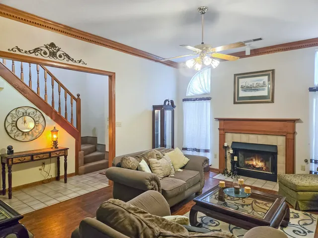 a view of a dining room with furniture and chandelier