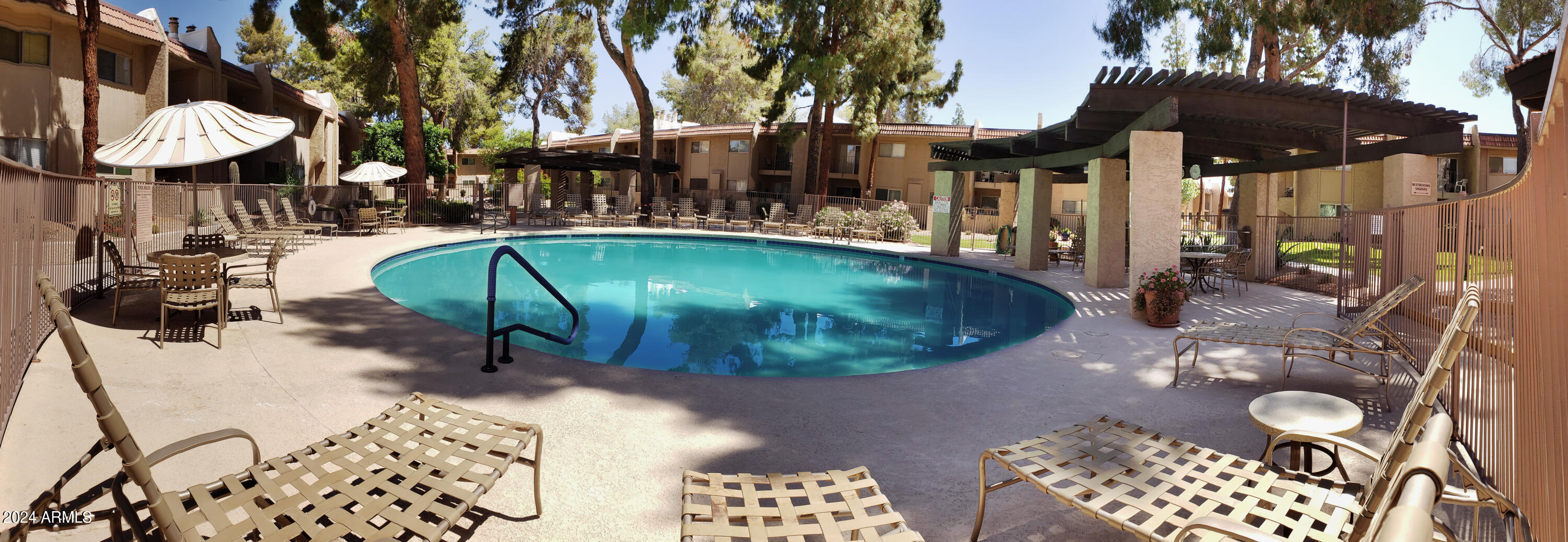 7436 East Chaparral Road, Unit 120B Scottsdale, AZ 85250 - Photo 11 of 24 a view of a chairs and table in backyard