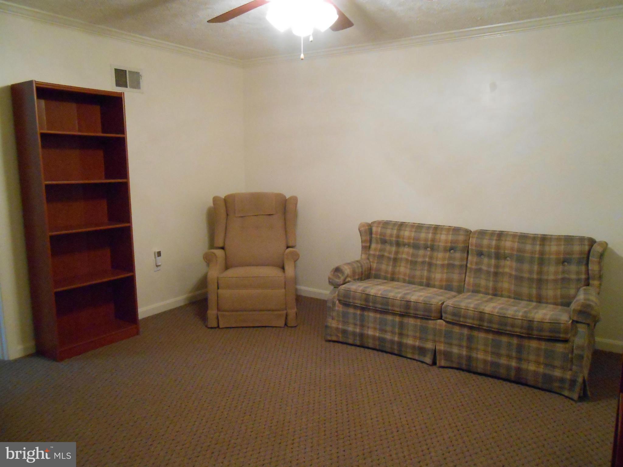 6956 Conservation Drive Springfield, VA 22153 - Photo 22 of 30 a bedroom with furniture and window