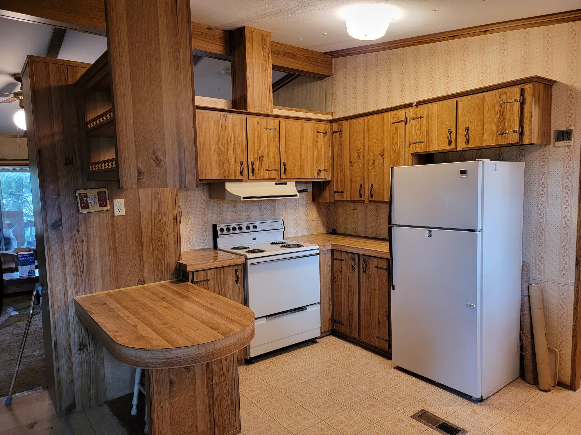 241 Gunnell Road Grants Pass, OR 97526 - Photo 12 of 23 a kitchen with stainless steel appliances granite countertop a refrigerator a stove and a sink