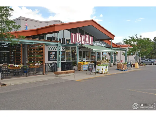 a front view of a building with sitting area
