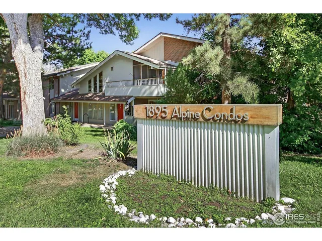 a view of a house with a small yard and plants