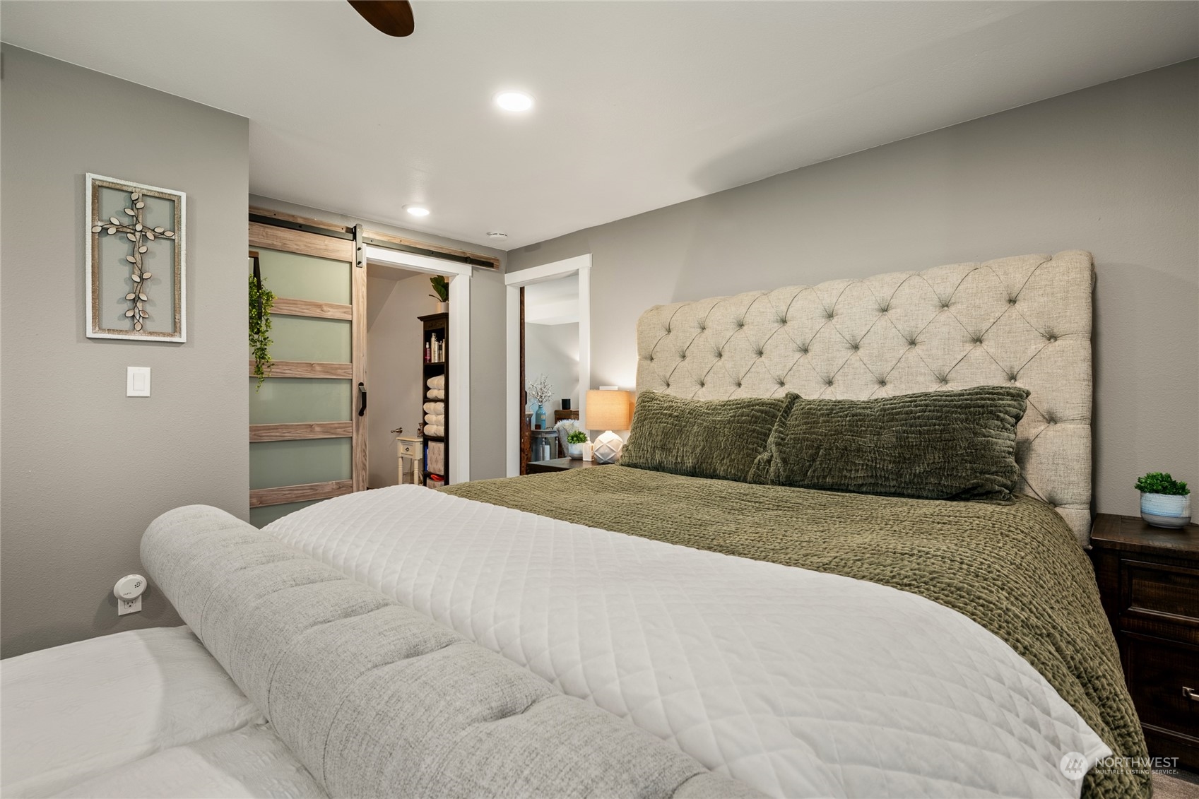 323 Edgewater Lane Lynden, WA 98264 - Photo 12 of 40 a bedroom with a bed and a painting on the wall