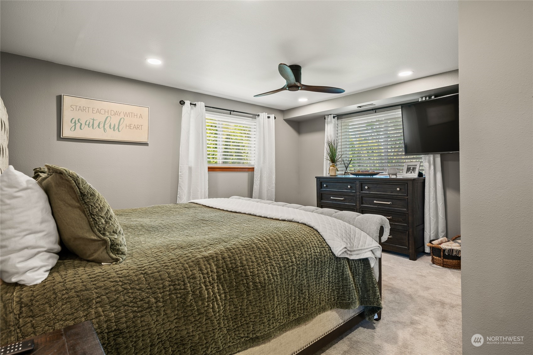 323 Edgewater Lane Lynden, WA 98264 - Photo 13 of 40 a bedroom with a bed and a flat screen tv