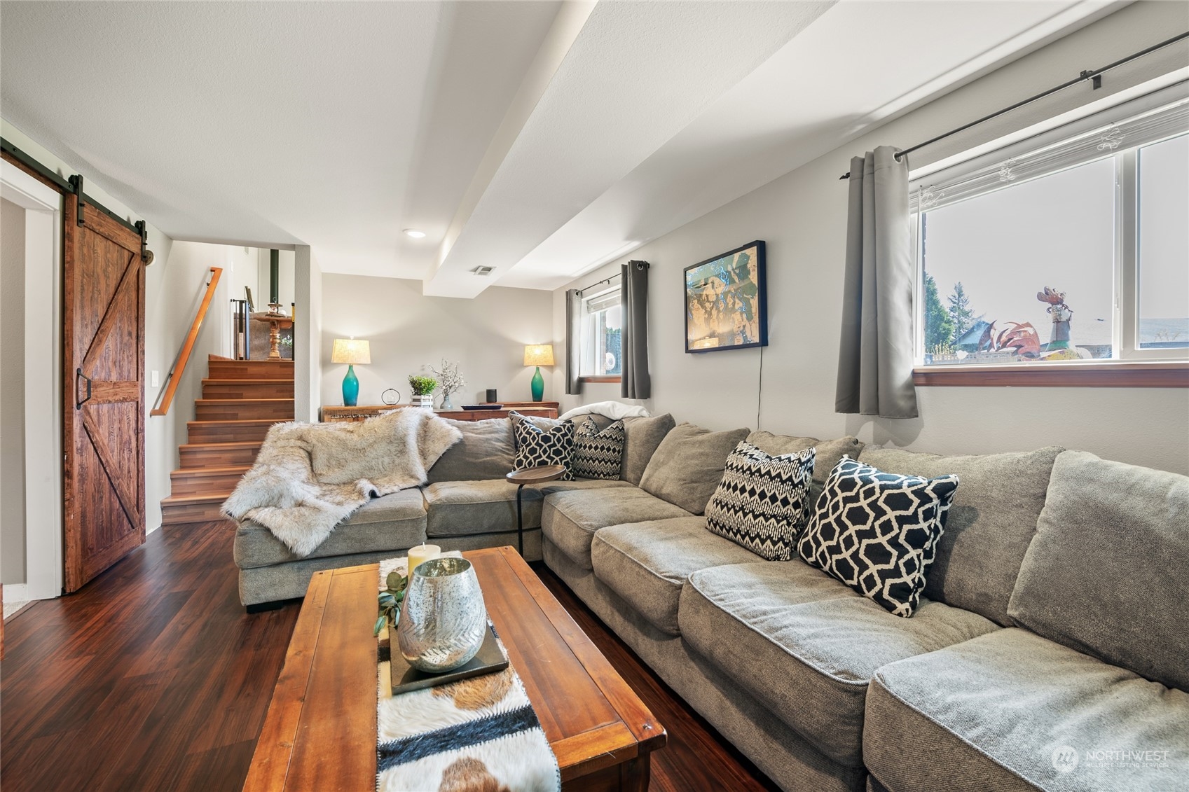 323 Edgewater Lane Lynden, WA 98264 - Photo 14 of 40 a living room with furniture and a large window