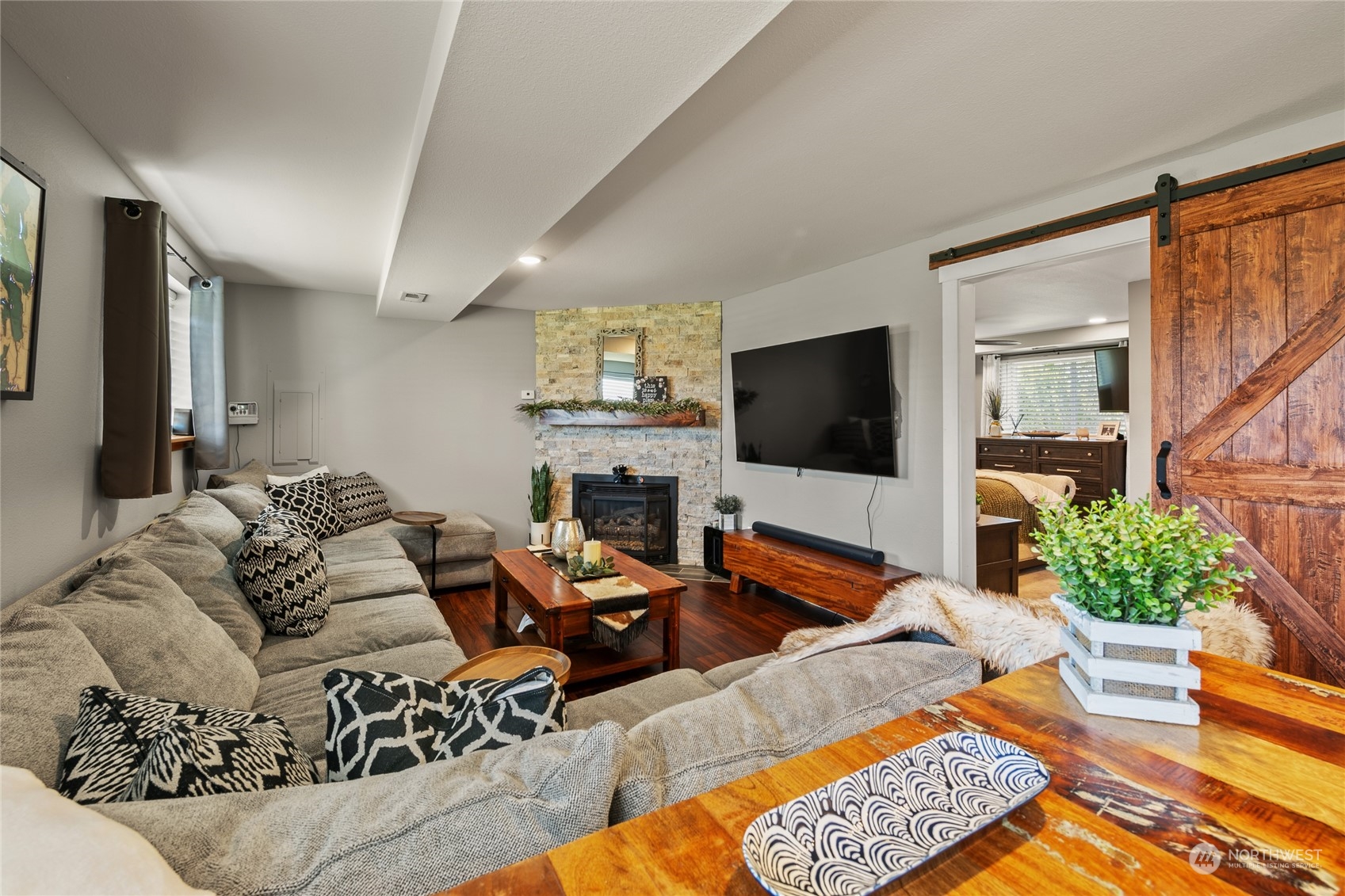 323 Edgewater Lane Lynden, WA 98264 - Photo 16 of 40 a living room with furniture and a flat screen tv