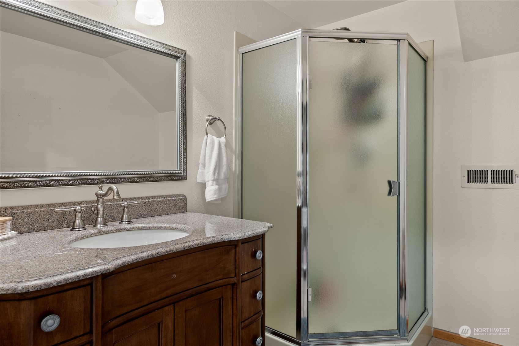 323 Edgewater Lane Lynden, WA 98264 - Photo 21 of 40 a bathroom with a granite countertop shower sink vanity and mirror