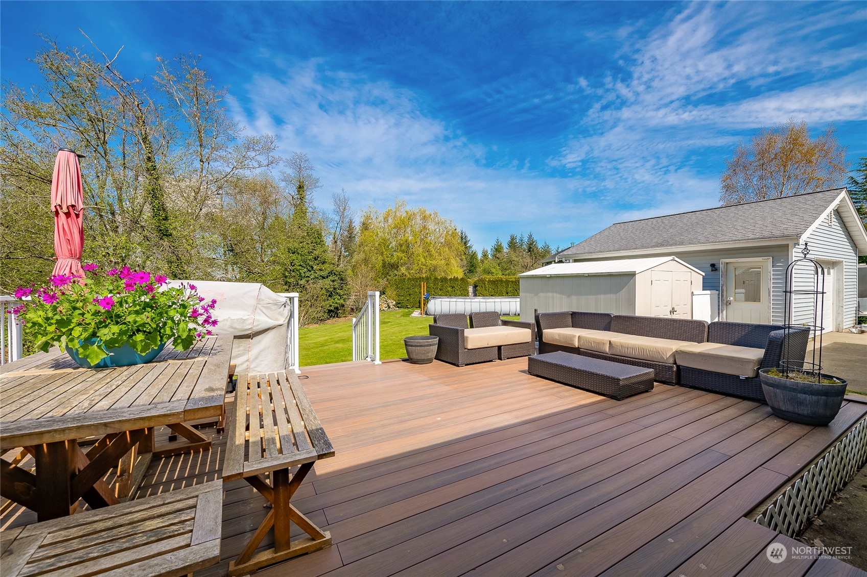 323 Edgewater Lane Lynden, WA 98264 - Photo 24 of 40 a view of a patio with couches table and chairs and potted plants