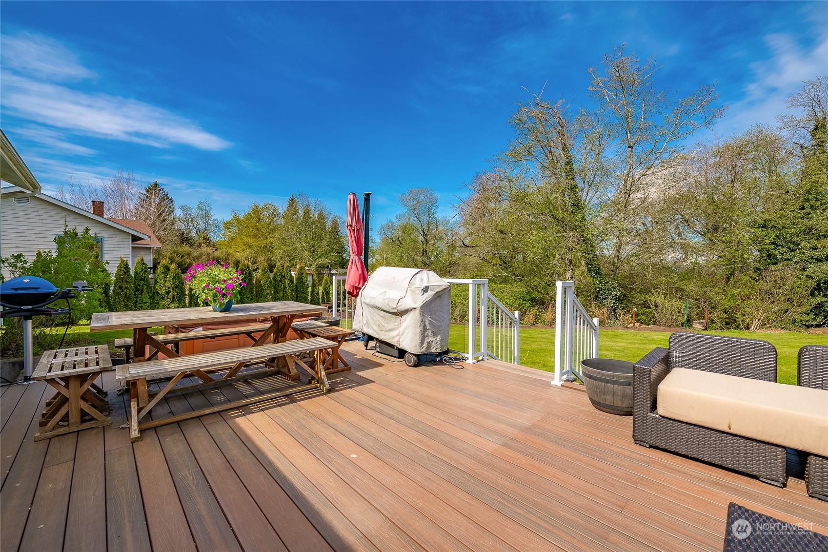 323 Edgewater Lane Lynden, WA 98264 - Photo 26 of 40 a view of a deck with wooden floor and outdoor seating