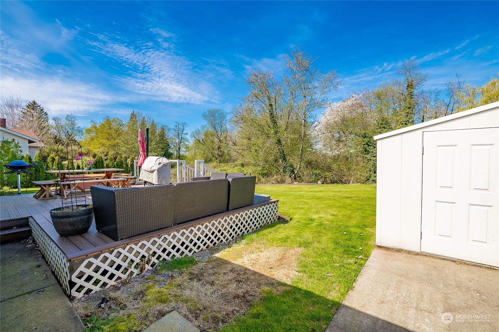 323 Edgewater Lane Lynden, WA 98264 - Photo 30 of 40 a view of a roof deck with couches and sky view