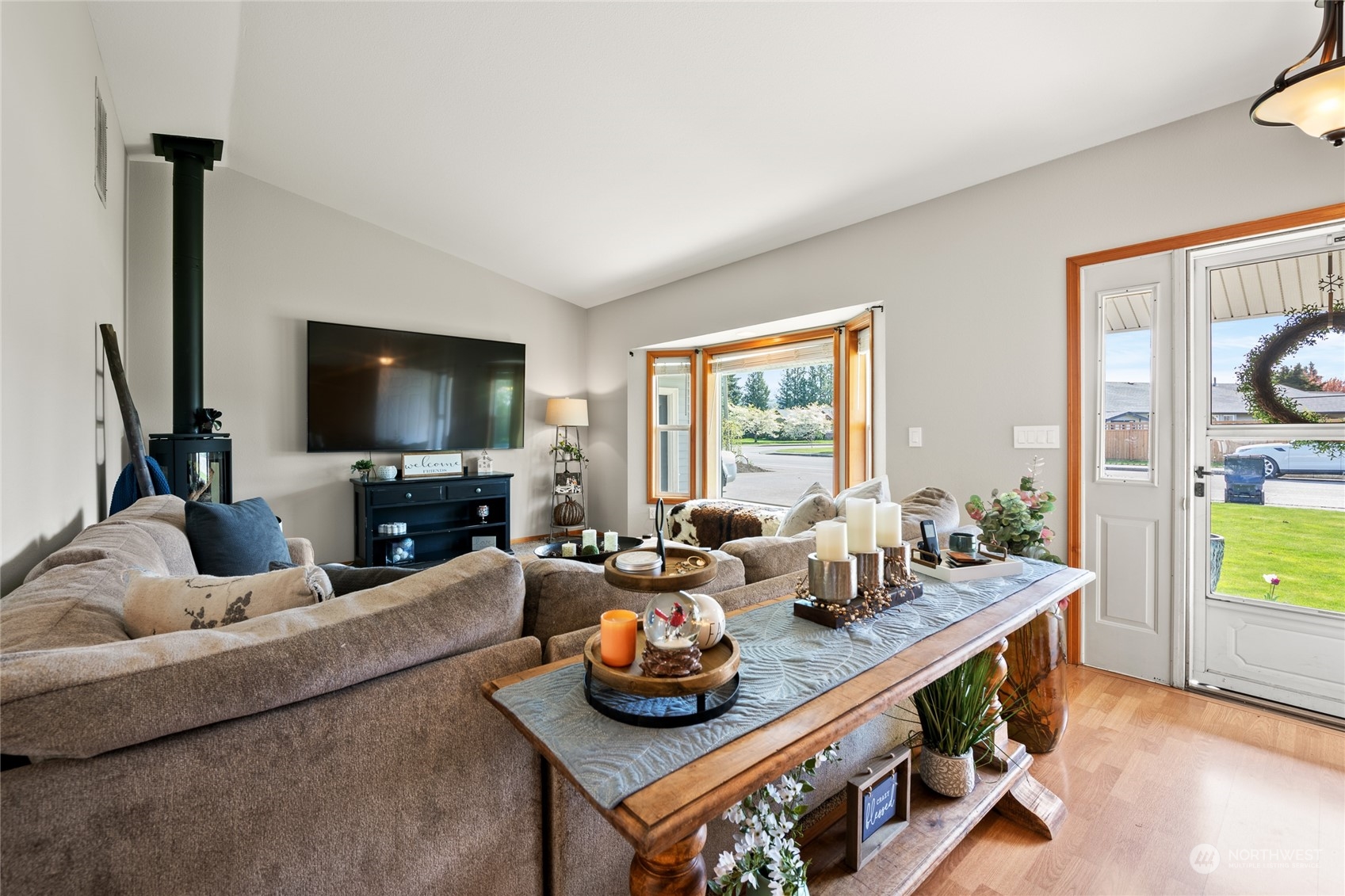 323 Edgewater Lane Lynden, WA 98264 - Photo 4 of 40 a living room with furniture and a flat screen tv