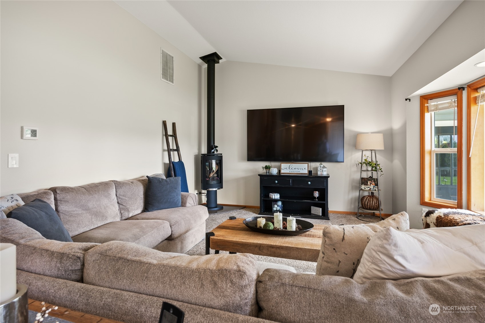 323 Edgewater Lane Lynden, WA 98264 - Photo 5 of 40 a living room with furniture and a flat screen tv