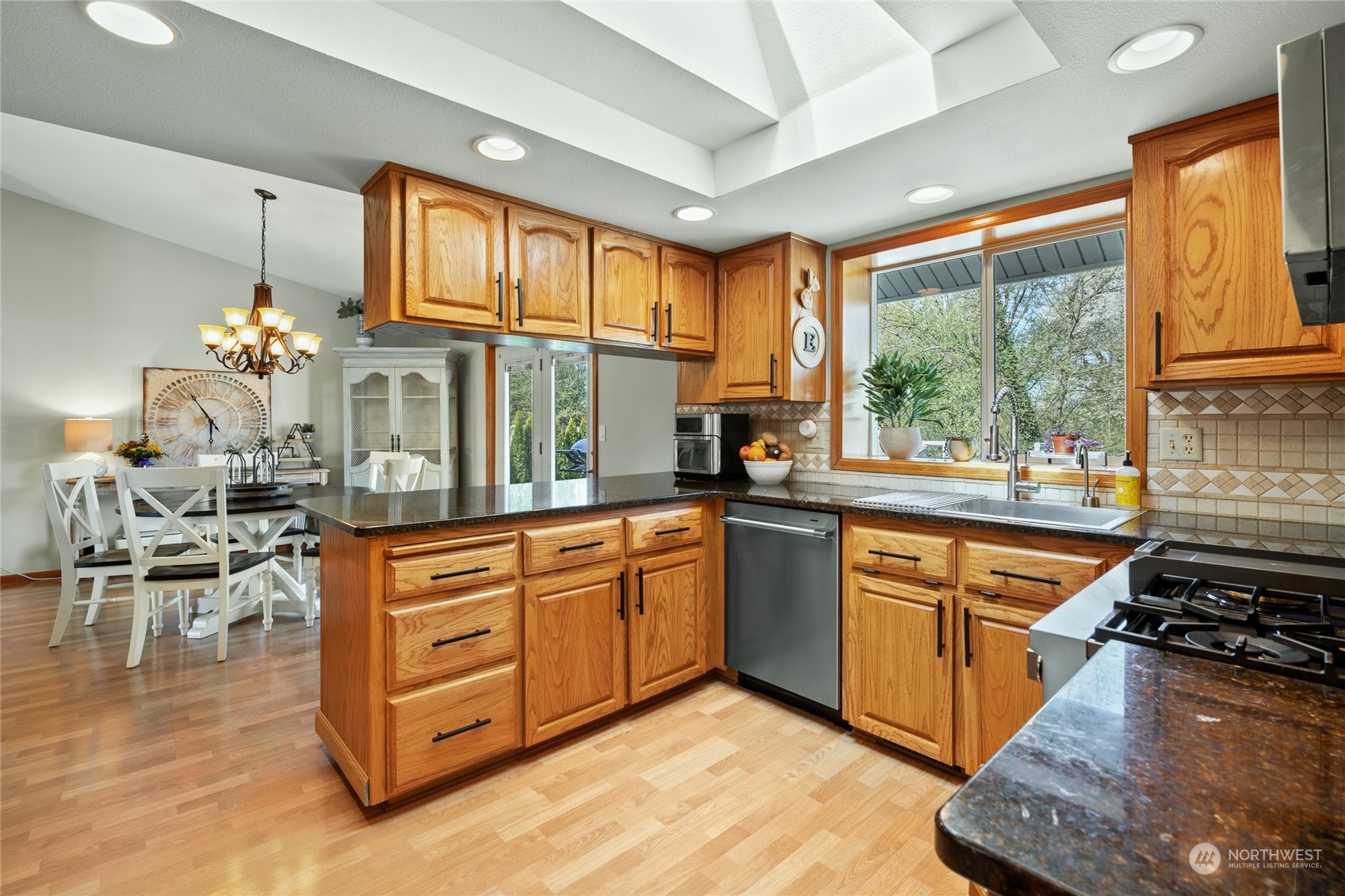 323 Edgewater Lane Lynden, WA 98264 - Photo 7 of 40 a kitchen with stainless steel appliances granite countertop a stove and a refrigerator